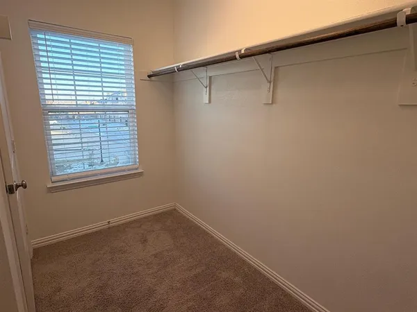 a view of a room that has a window in it