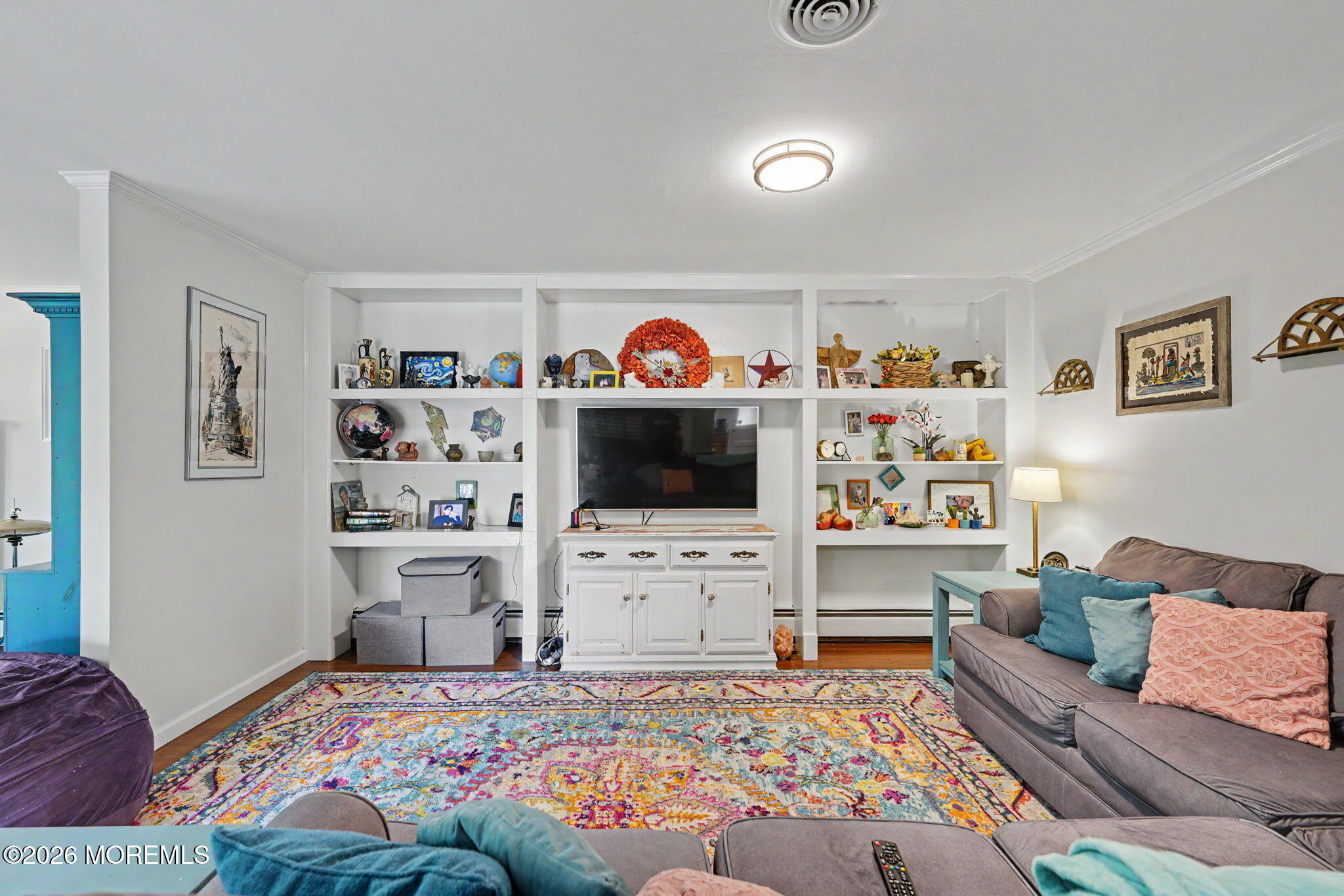 699 Aldrich Road Howell, NJ 07731 - Photo 13 of 30 a living room with furniture and a flat screen tv