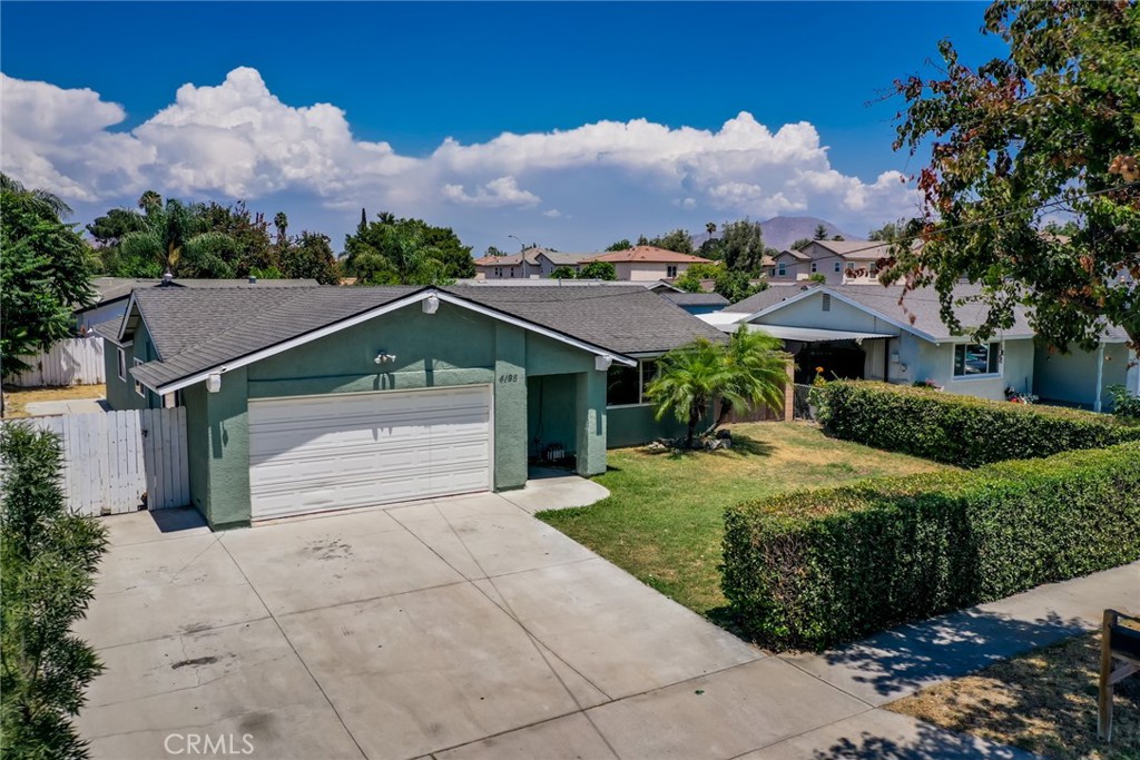 4195 Strong Street Riverside, CA 92501 - Photo 1 of 1 front view of house with a yard