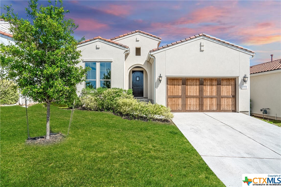 4313 Flameleaf Sumac Drive Austin, TX 78738 - Photo 1 of 1 a front view of a house with a yard