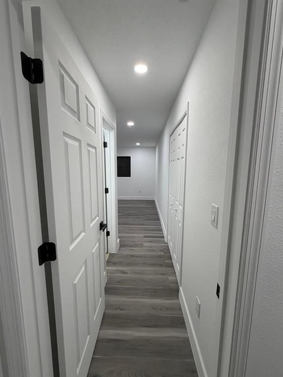 731 Bongart Road Winter Park, FL 32792 - Photo 15 of 28 a view of a hallway with wooden floor and staircase