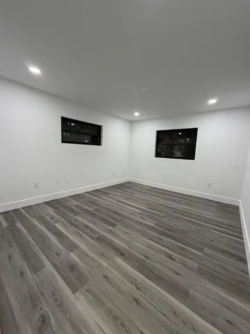 a view of a livingroom with wooden floor