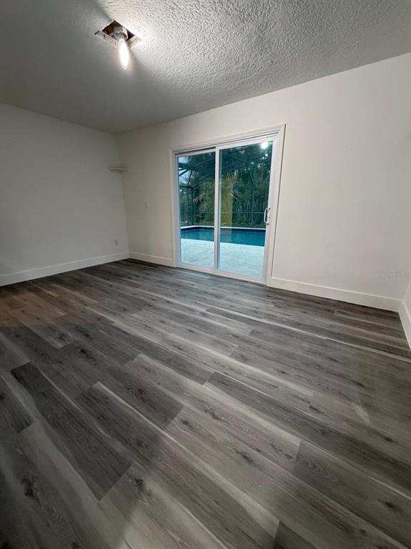 731 Bongart Road Winter Park, FL 32792 - Photo 19 of 28 a view of an empty room with wooden floor and a window