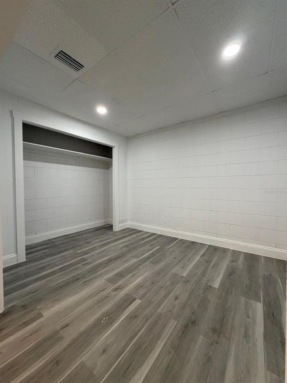 731 Bongart Road Winter Park, FL 32792 - Photo 24 of 28 an empty room with wooden floor and windows