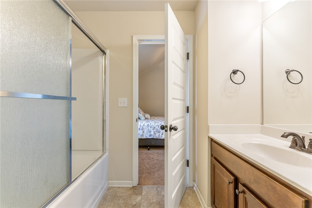 5 Tolkien Drive Anderson, SC 29621 - Photo 27 of 36 Tiled flooring and a modern vanity line this functional bathroom space.