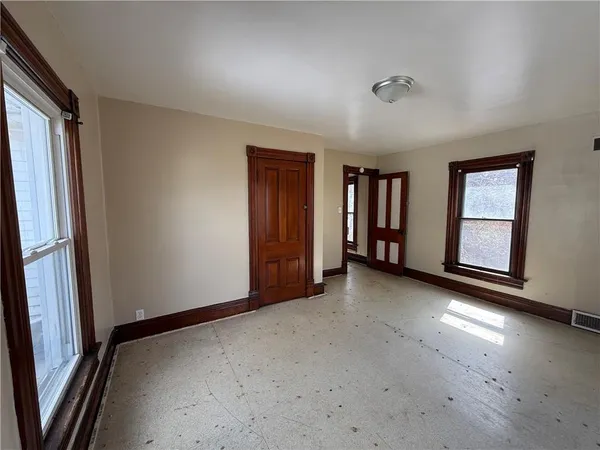 an empty room with windows
