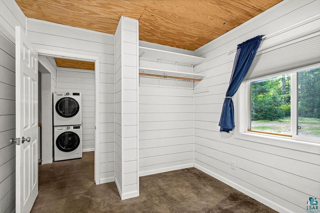 1159 Wales Road Two Harbors, MN 55616 - Photo 7 of 29 White shiplap walls, built-in shelving, wood ceiling, and a double-pane window