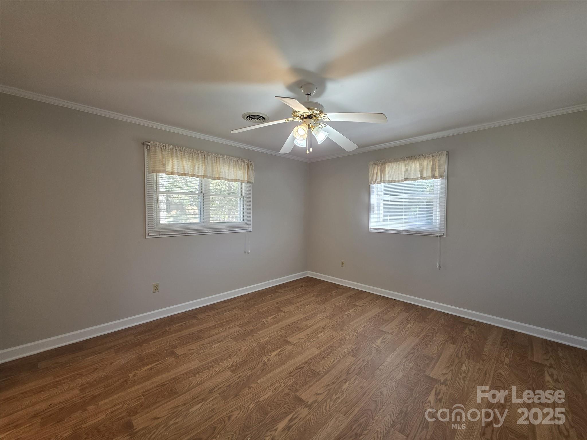 9301 Gold Hill Road Mount Pleasant, NC 28124 - Photo 16 of 32 wooden floor in an empty room with a window