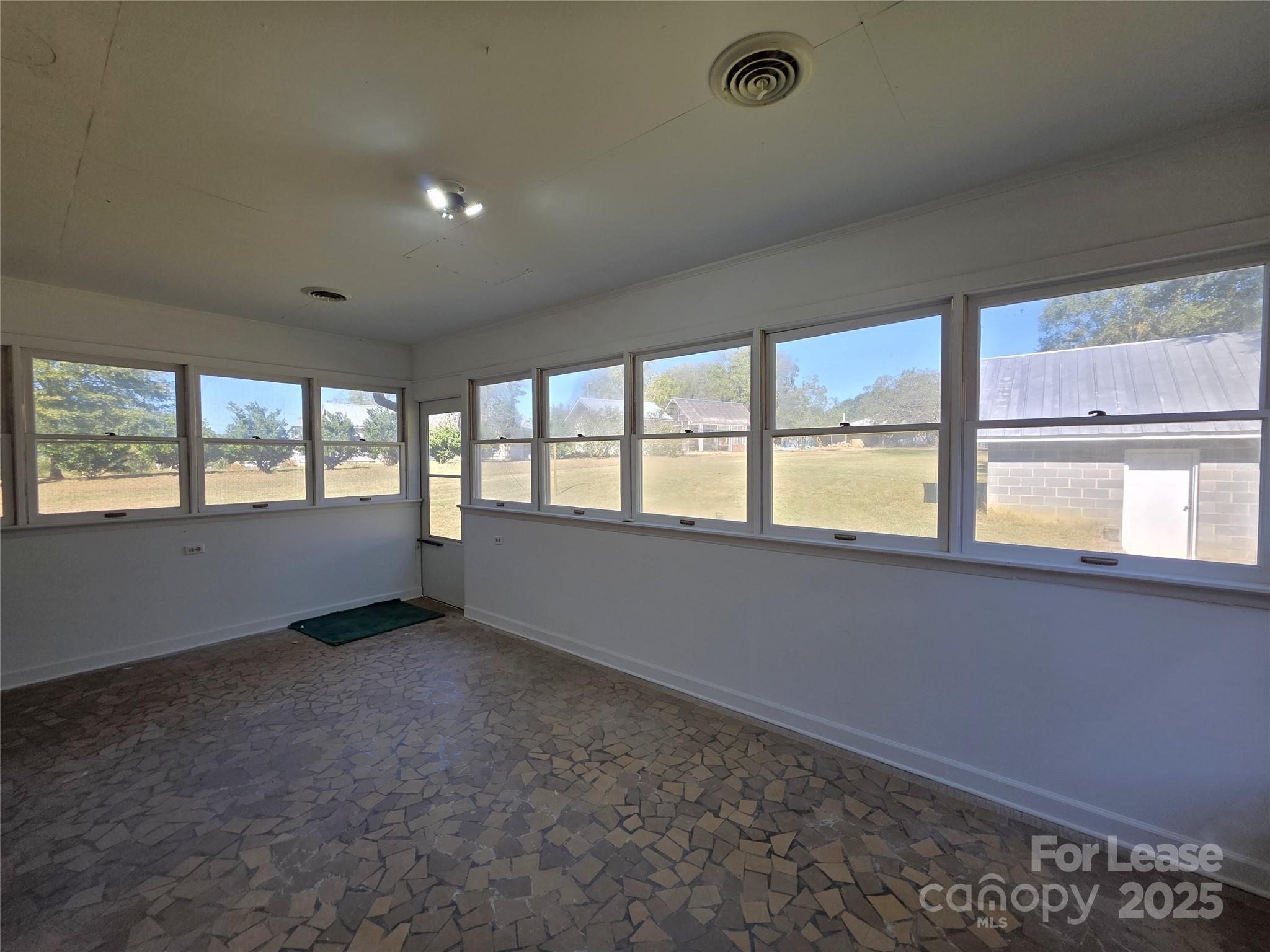 9301 Gold Hill Road Mount Pleasant, NC 28124 - Photo 21 of 32 an empty room with windows
