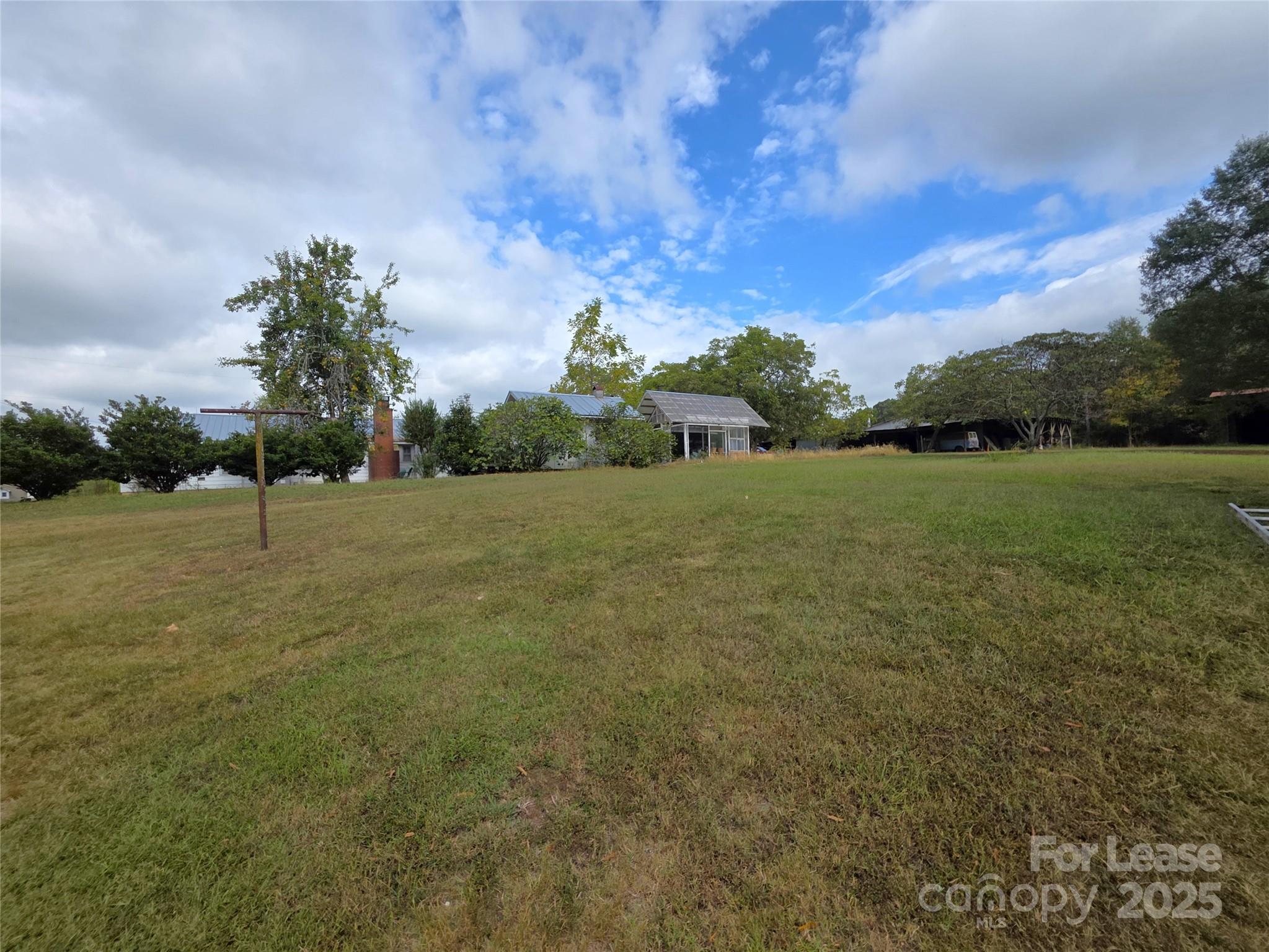 9301 Gold Hill Road Mount Pleasant, NC 28124 - Photo 32 of 32 a view of a field with an trees