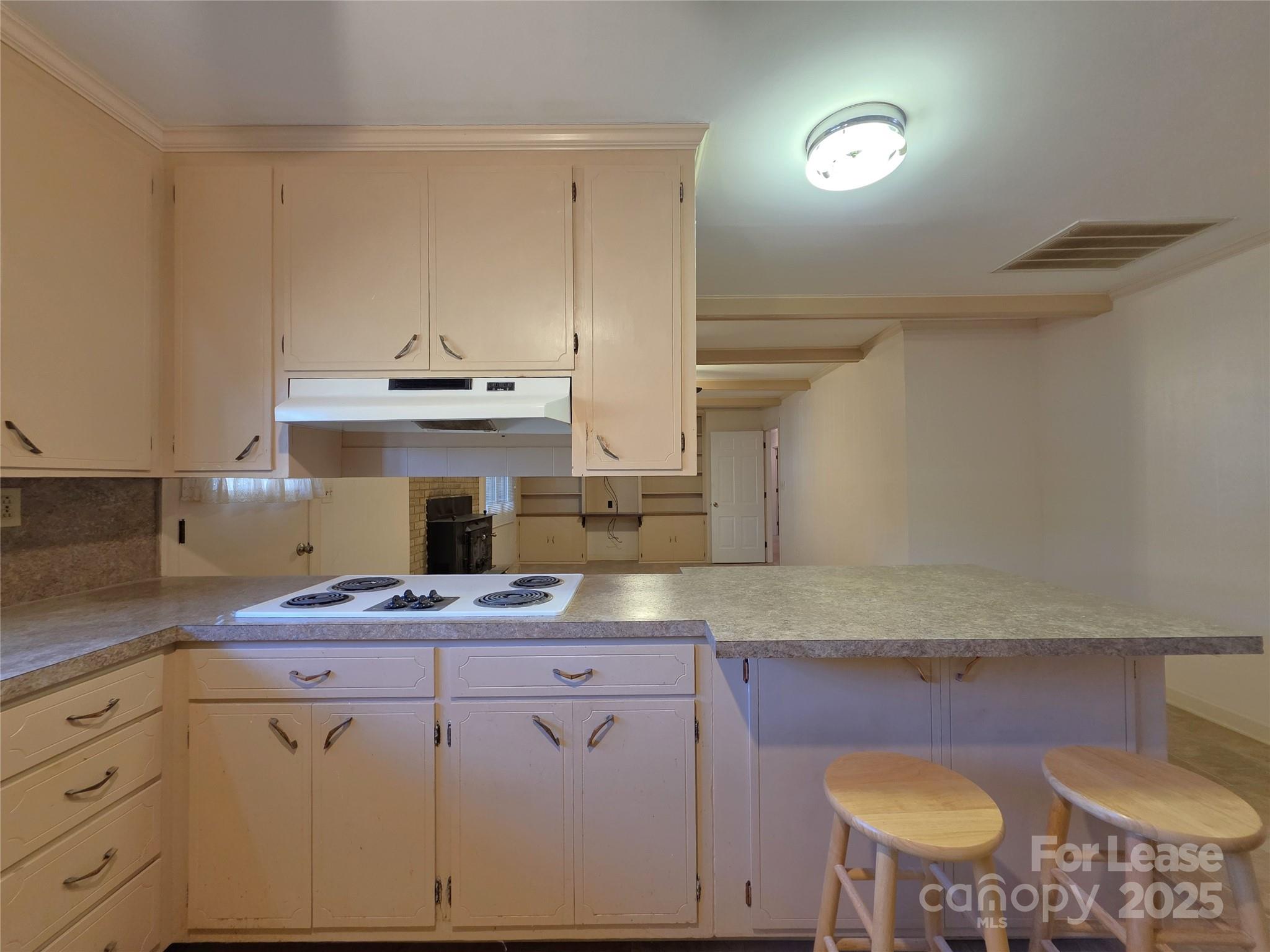 9301 Gold Hill Road Mount Pleasant, NC 28124 - Photo 7 of 32 a kitchen with cabinets and wooden floor