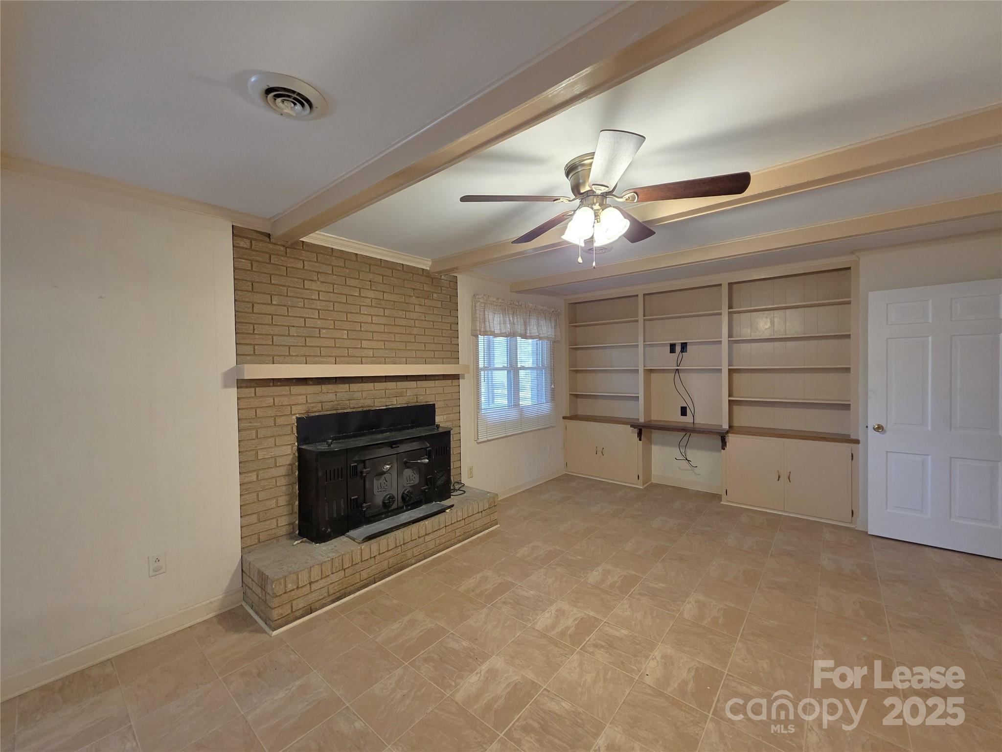9301 Gold Hill Road Mount Pleasant, NC 28124 - Photo 9 of 32 a view of a livingroom with a ceiling fan fireplace and a window