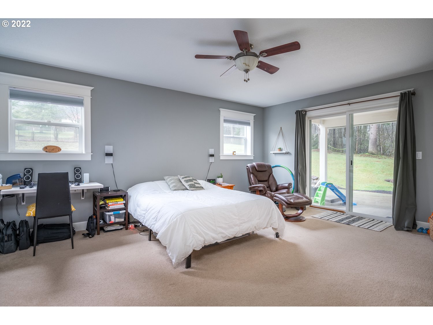 686 Eufaula Heights Road Longview, WA 98632 - Photo 14 of 29 a bedroom with a bed a large window with table and chairs