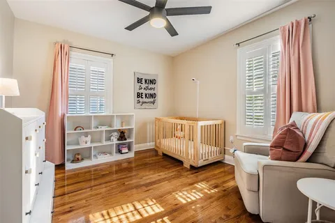 a bedroom with furniture and a window