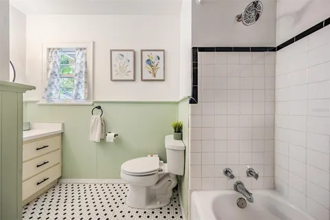 a bathroom with a sink a toilet and a bathtub