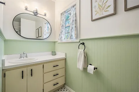 a bathroom with a sink and a mirror