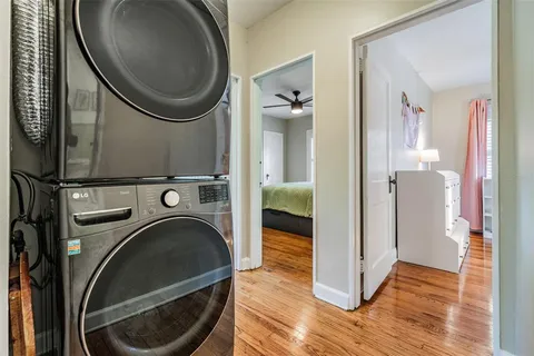 a view of a hallway with washer and dryer