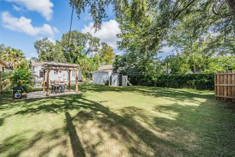 a house with swimming pool in front of it