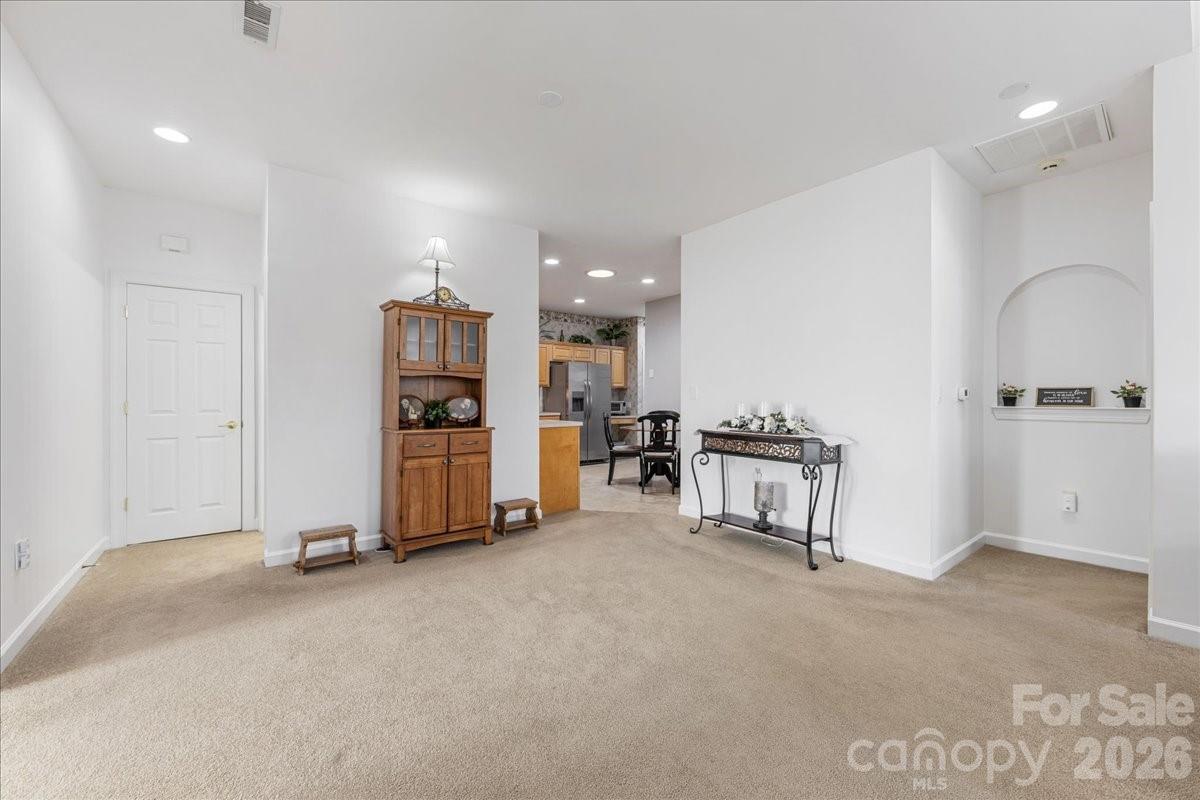 8368 Windsor Ridge Drive Charlotte, NC 28277 - Photo 15 of 46 a view of an empty room with kitchen and a window