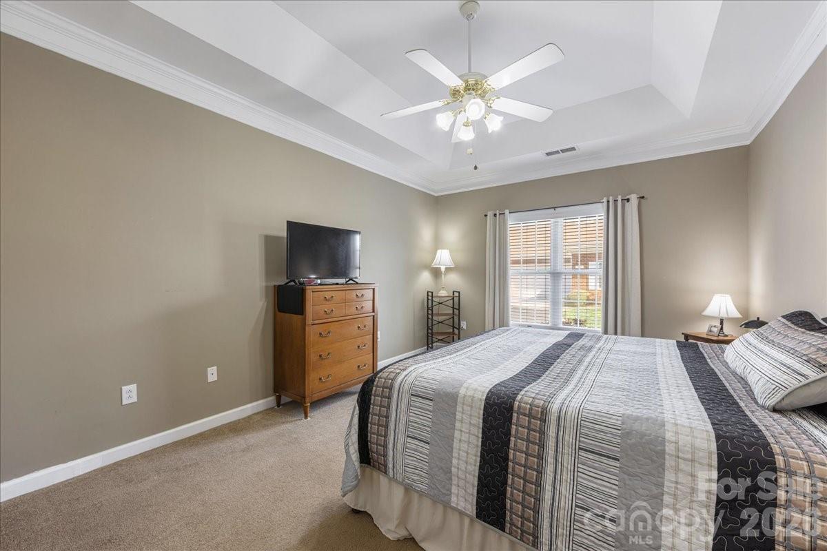 8368 Windsor Ridge Drive Charlotte, NC 28277 - Photo 24 of 46 a bedroom with a large bed and a tv