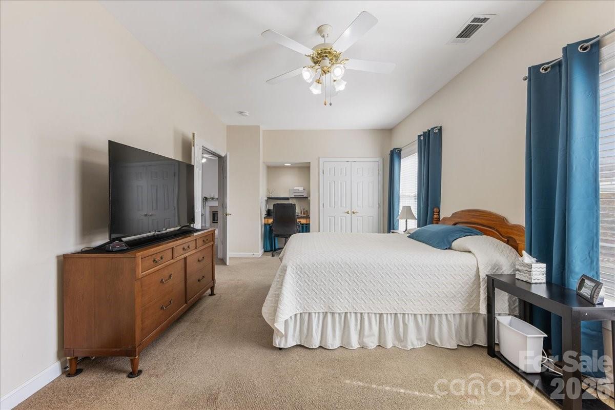 8368 Windsor Ridge Drive Charlotte, NC 28277 - Photo 31 of 46 a bedroom with a bed and a flat screen tv