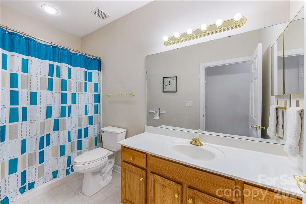 8368 Windsor Ridge Drive Charlotte, NC 28277 - Photo 34 of 46 a bathroom with a sink and a mirror