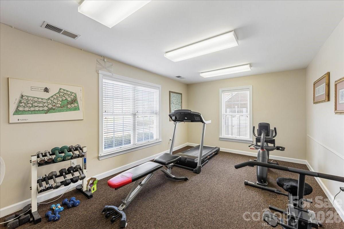 8368 Windsor Ridge Drive Charlotte, NC 28277 - Photo 44 of 46 a view of a room with gym equipment and a window