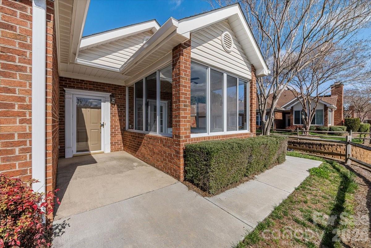 8368 Windsor Ridge Drive Charlotte, NC 28277 - Photo 6 of 46 a front view of a house with a garden