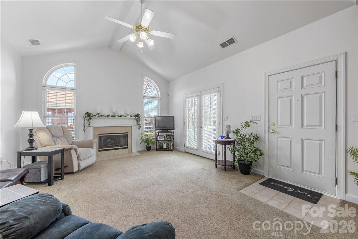 8368 Windsor Ridge Drive Charlotte, NC 28277 - Photo 8 of 46 a living room with furniture and a fireplace