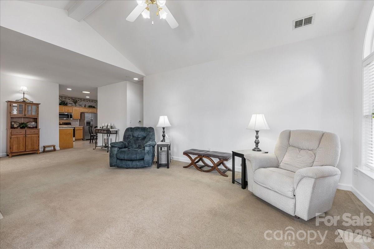 8368 Windsor Ridge Drive Charlotte, NC 28277 - Photo 10 of 46 a living room with furniture and a chandelier