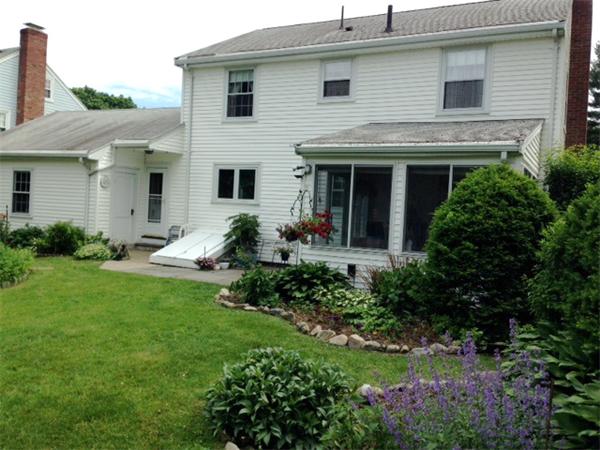 41 Longfellow Road Needham, MA 02494 - Photo 11 of 20 a view of a house with a yard and plants