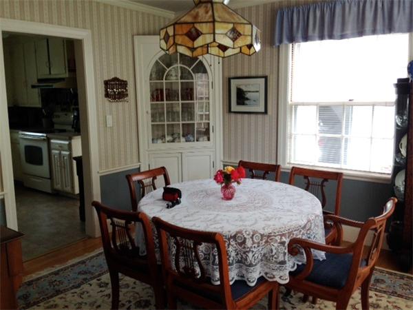 41 Longfellow Road Needham, MA 02494 - Photo 4 of 20 a view of a dining room with furniture and window