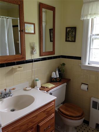 41 Longfellow Road Needham, MA 02494 - Photo 8 of 20 a bathroom with a toilet sink and mirror