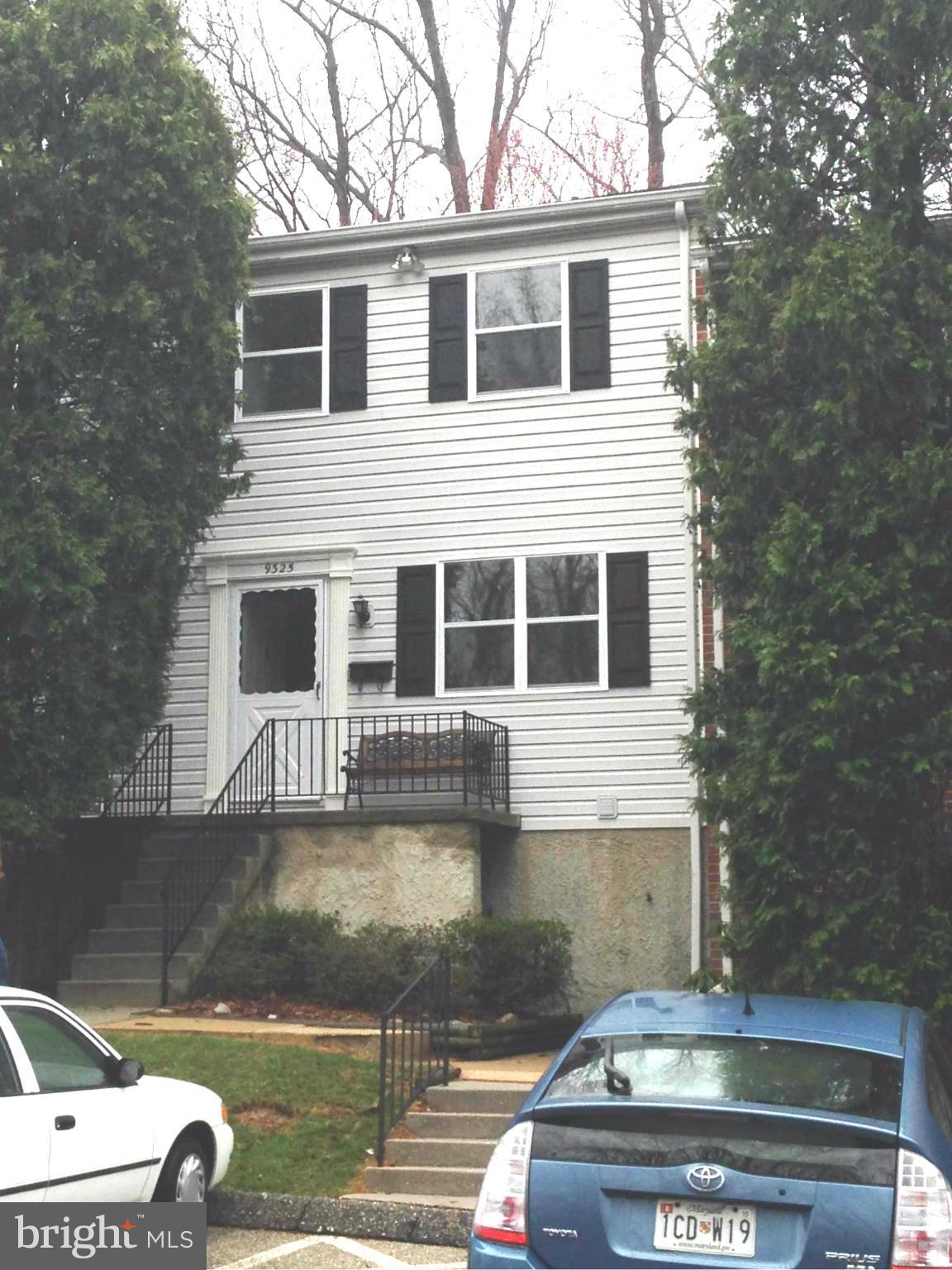 9325 Pan Ridge Road Baltimore, MD 21234 - Photo 1 of 20 a front view of a house with a yard