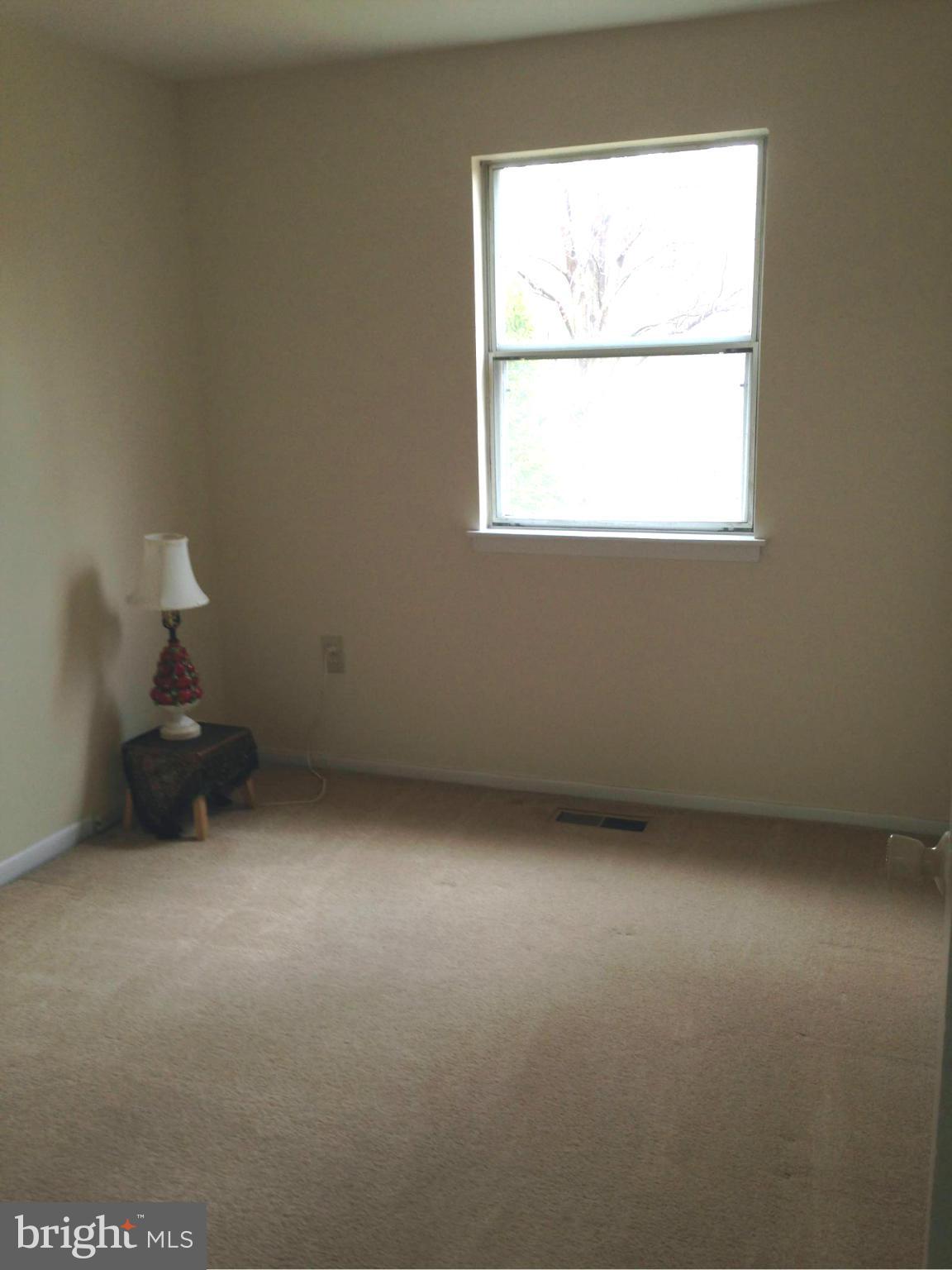 9325 Pan Ridge Road Baltimore, MD 21234 - Photo 14 of 20 an empty room with a window