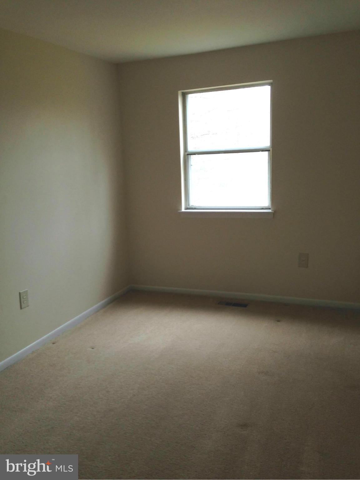 9325 Pan Ridge Road Baltimore, MD 21234 - Photo 15 of 20 an empty room with a window