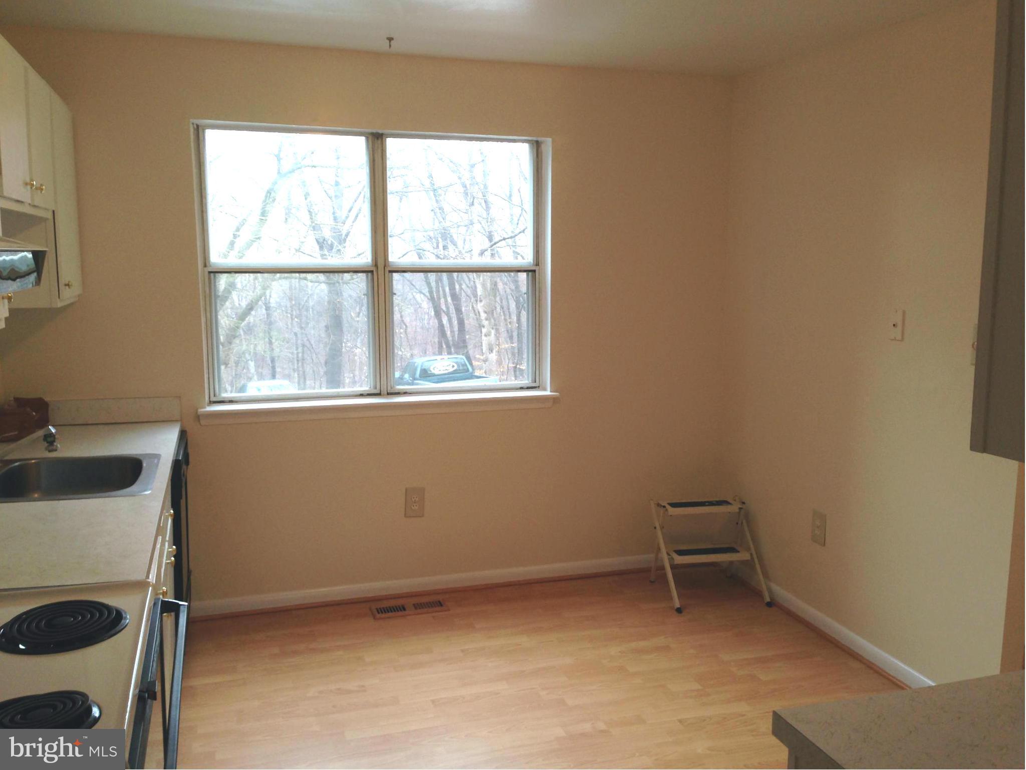 9325 Pan Ridge Road Baltimore, MD 21234 - Photo 4 of 20 a view of an empty room with a window