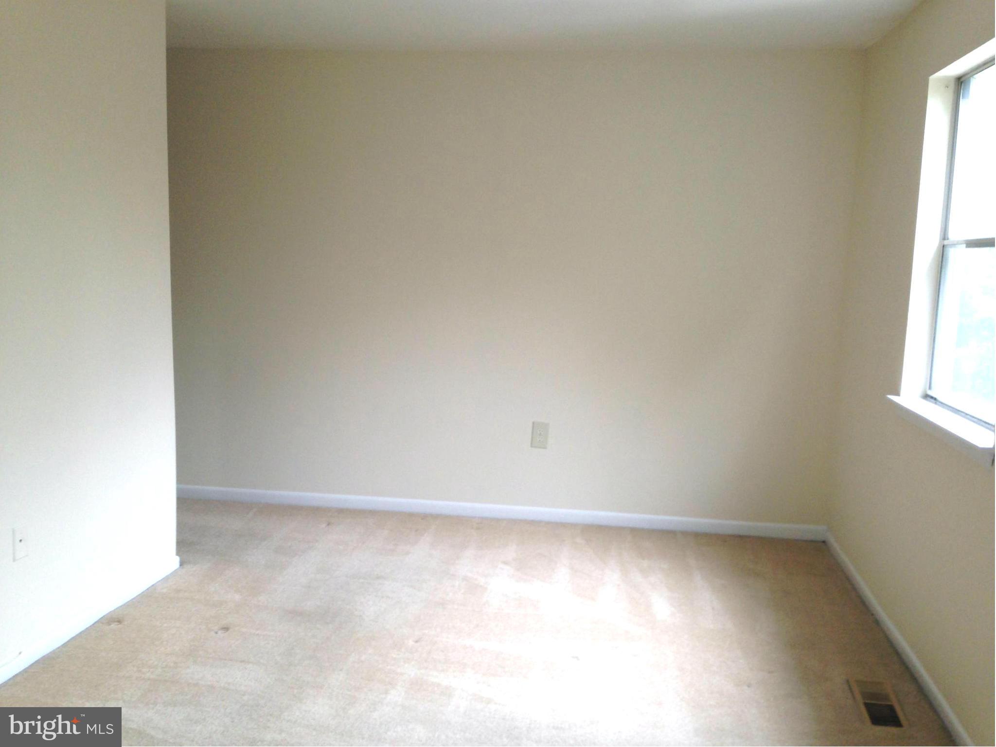 9325 Pan Ridge Road Baltimore, MD 21234 - Photo 9 of 20 an empty room with a window