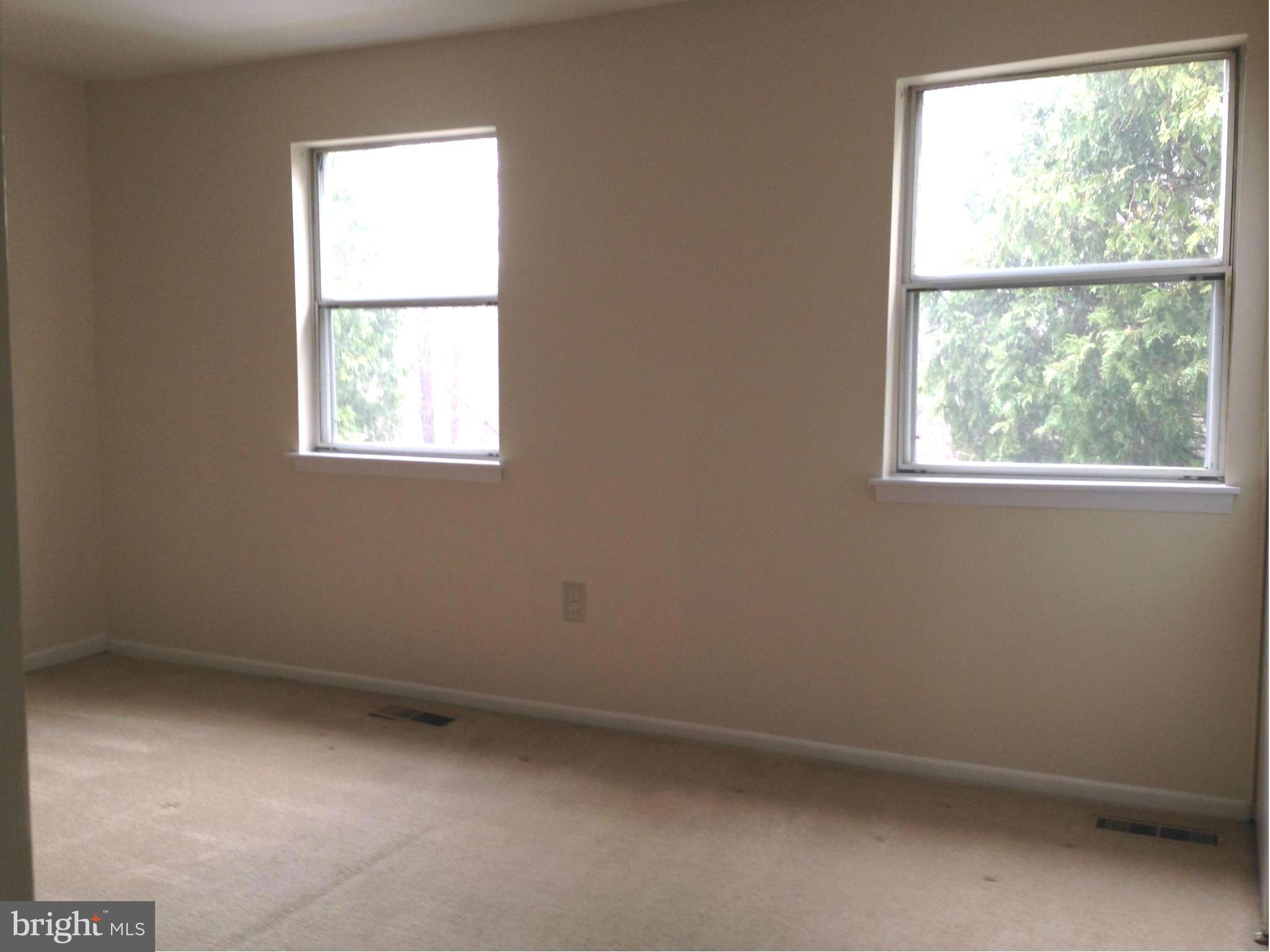 9325 Pan Ridge Road Baltimore, MD 21234 - Photo 10 of 20 an empty room with a window