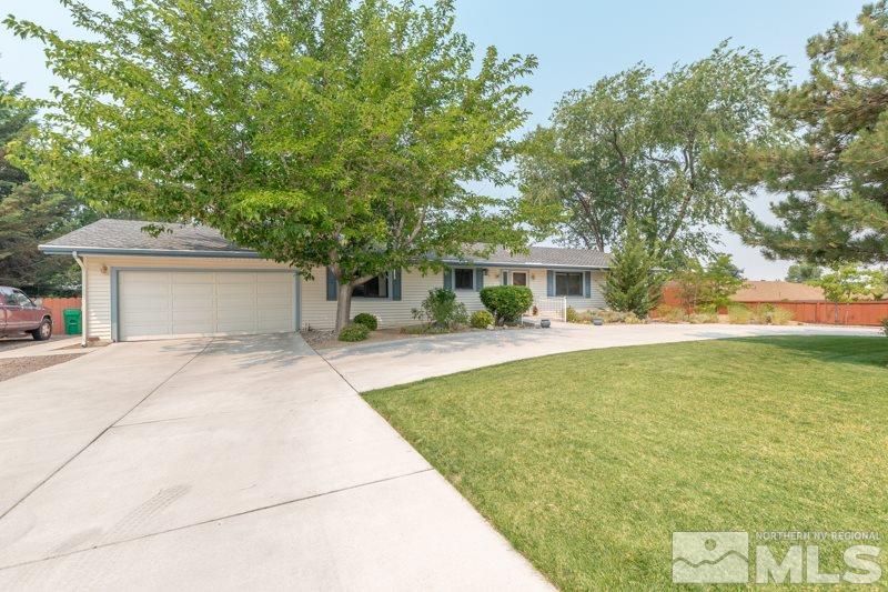 13935 Kewanna Trail Reno, NV 89521 - Photo 4 of 21 a front view of a house with a garden