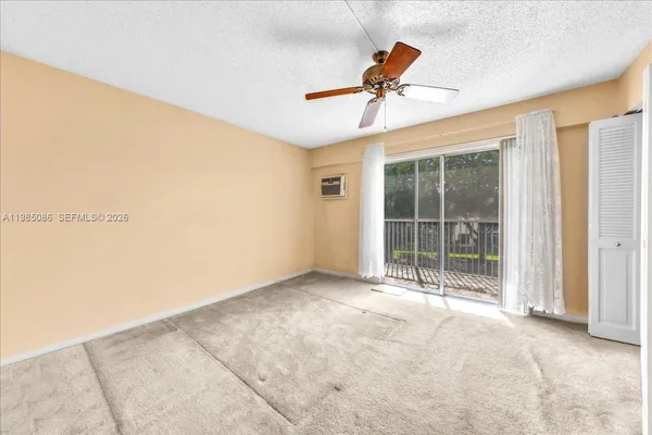a view of room with ceiling fan
