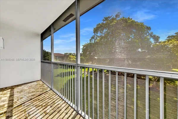 a view of a bedroom with wooden floor and bedroom