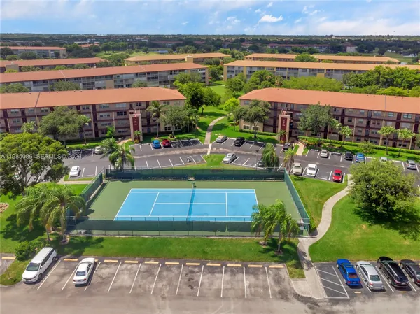an aerial view of a tennis ground and a terrace