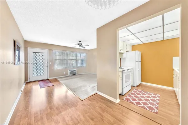 a view of an empty room with a window