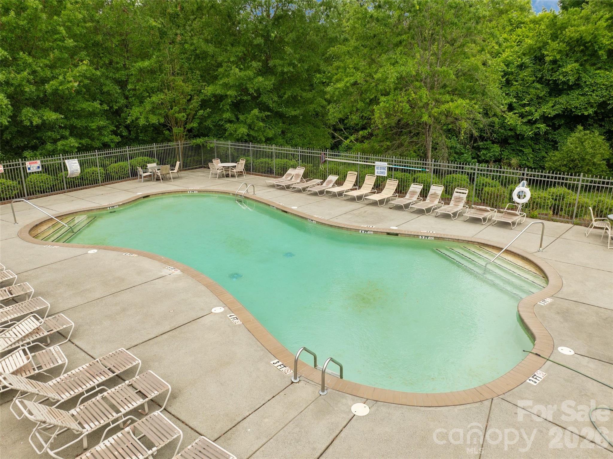 8726 Conrad Street Locust, NC 28097 - Photo 36 of 36 a view of a swimming pool with a patio