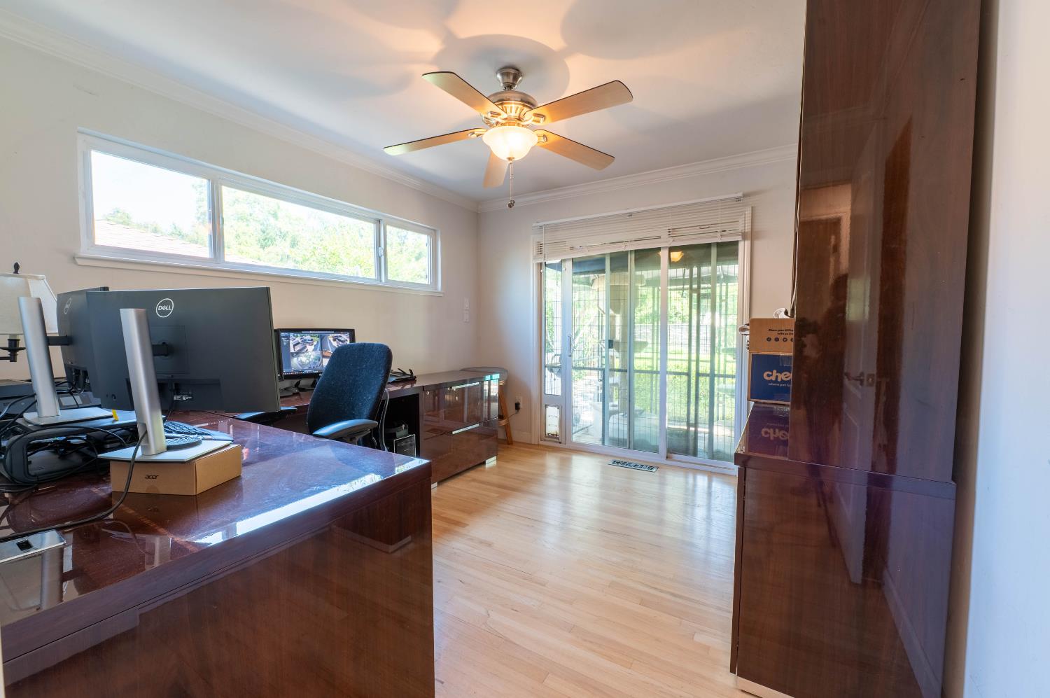 4530 Bela Way Carmichael, CA 95608 - Photo 18 of 36 Large bedroom across from the primary - has sliding doors to the backyard. (Catio can stay or be removed.)