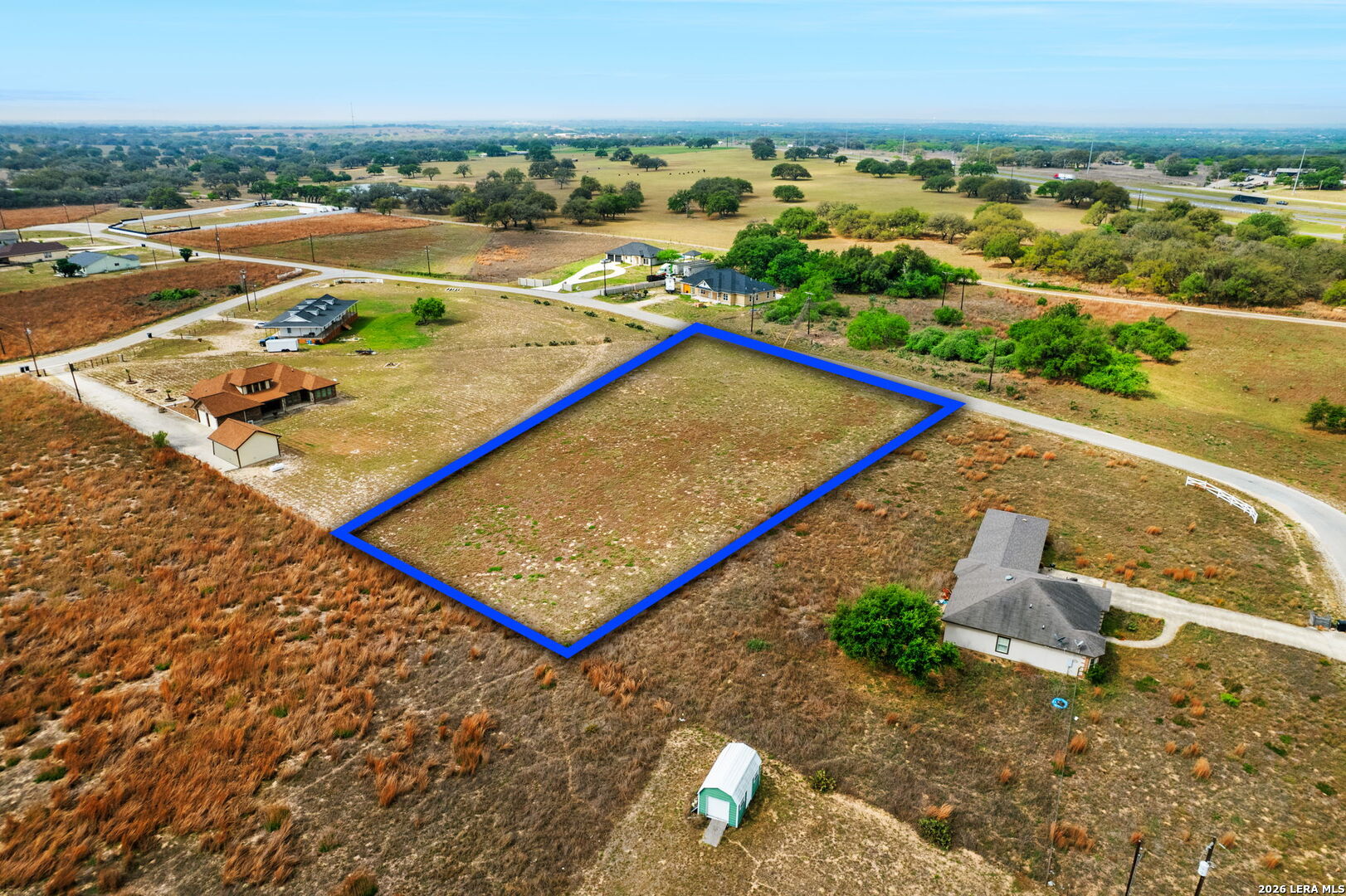 215 Mustang Ridge Natalia, TX 78059 - Photo 5 of 17 an aerial view of a tennis court