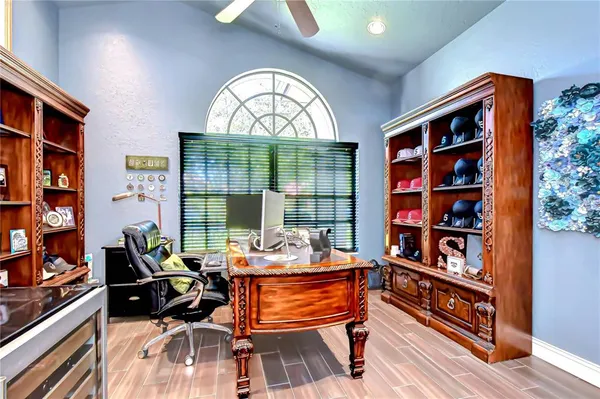 a large kitchen with a table and chairs