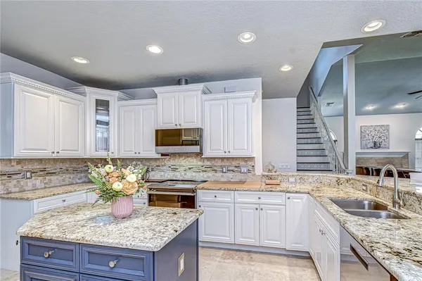 a bed sitting in a bedroom next to a large window