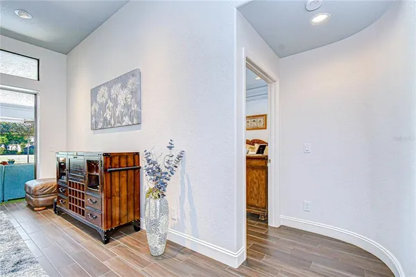 a view of a hallway view with wooden floor and staircase